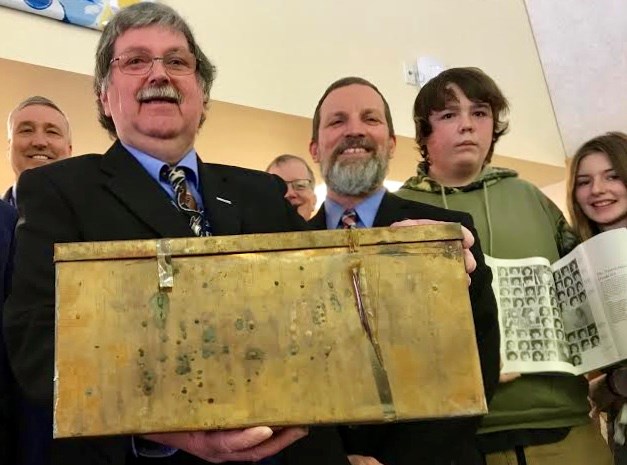 Simcoe County District School Board Chair Peter Beacock, left and Elmvale District High School Principal Dan MacDonald opened the time capsule found hidden in a wall of the school.
Sue Sgambati/BarrieToday