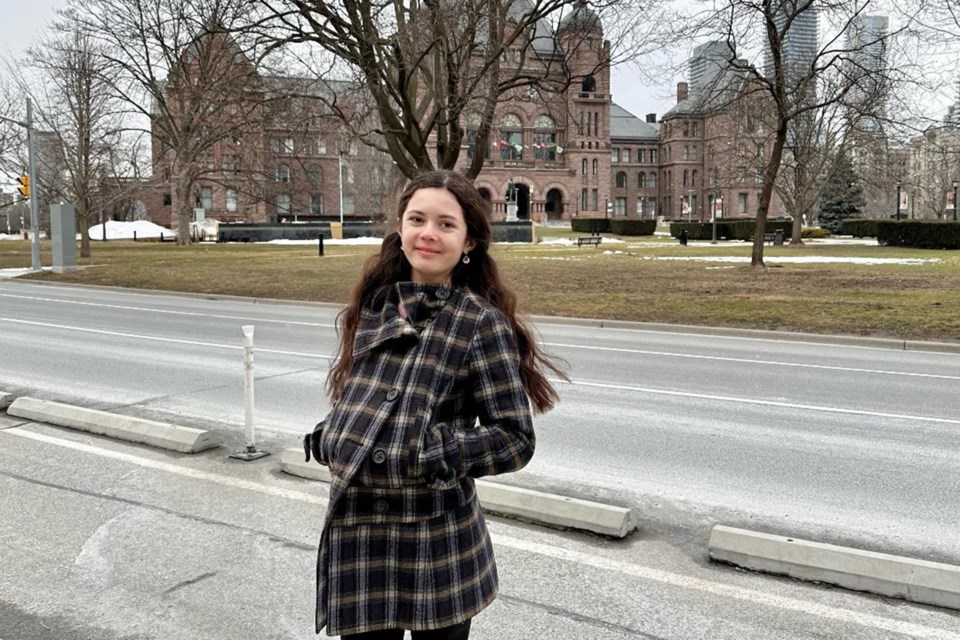 Morgan Burkitt, who served as a page recently, stands in Queen's Park at the Ontario Legislature.