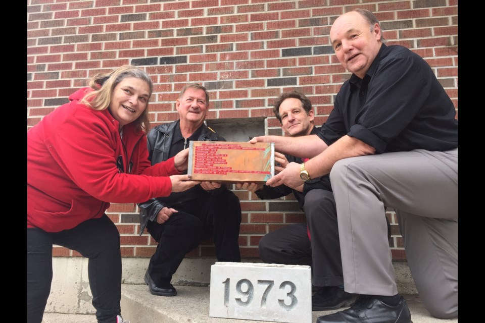 Pictured with the time capsule from left to right are former student Nancy Dickey, former  teacher John Kraft, alumnist and current principal Greg Brucker, and alumnist Jeff Walther.  Sue Sgambati/BarrieToday