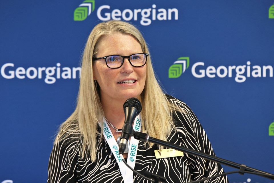 Jill Tettmann, CEO of the YMCA of Simcoe/Muskoka, speaks at Georgian College on Wednesday, announcing a new partnership between them.