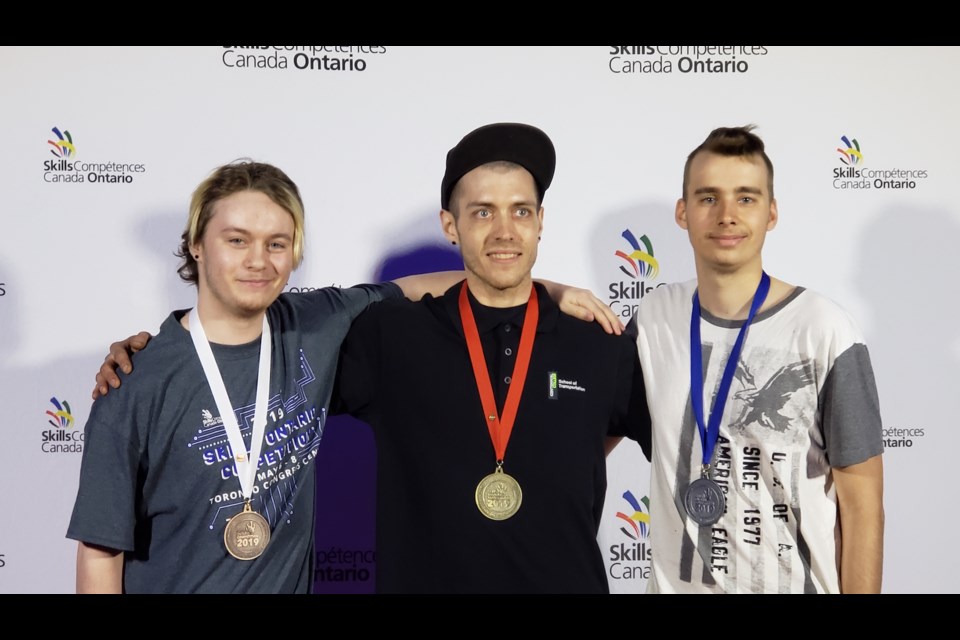 Georgian College students won two medals in the outdoor powered equipment category at the Skills Ontario Competition held May 6 to 8. Shawn Hejno (far right) won a silver medal and Austin Brown (far left) took home a bronze medal. Supplied photo