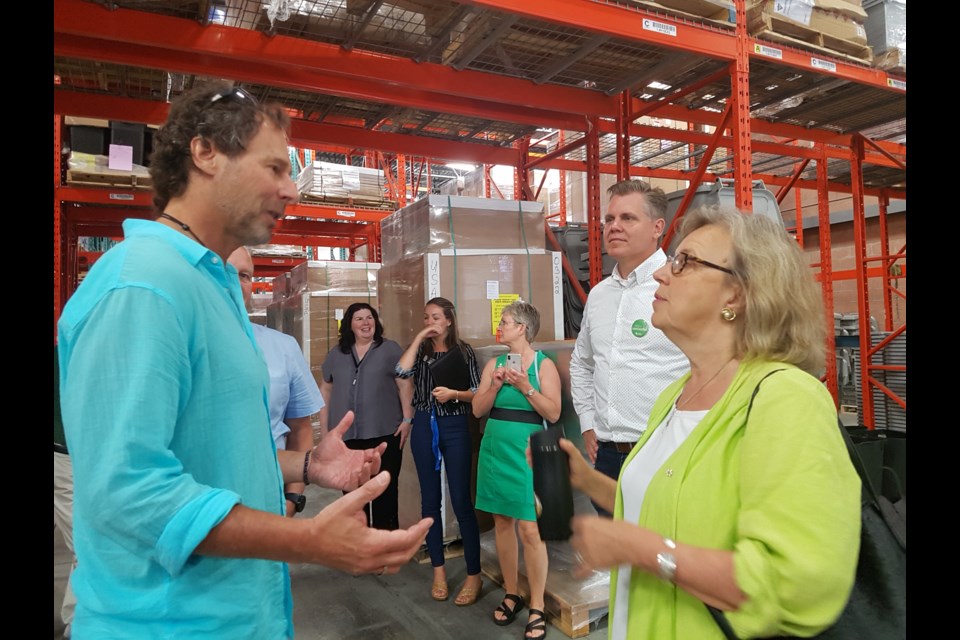 Craig Busch, left, explains the process of his Busch Systems company to federal Green Party leader Elizabeth May during her stop in Barrie on Thursday, July 18, 2019. Shawn Gibson/BarrieToday