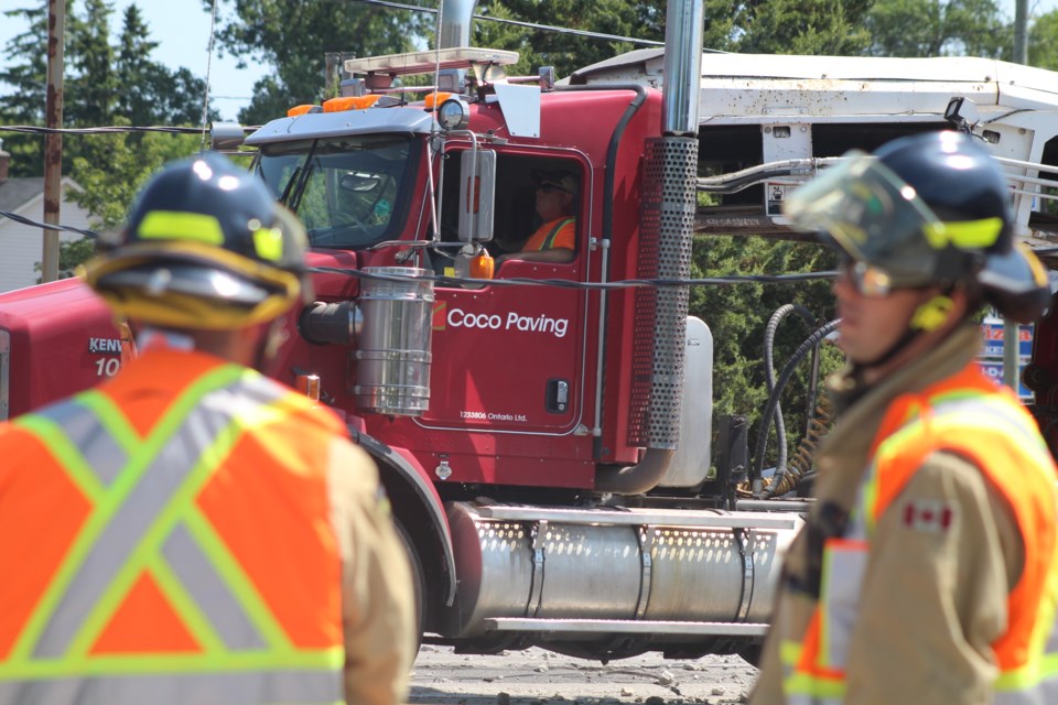 The driver of a truck that struck a hydro pole at the corner of Anne and Dunlop street had to remain in the cab until crews were able to ensure the scene was safe. Raymond Bowe/BarrieToday