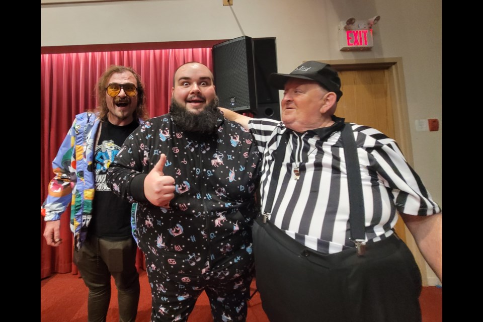 Barrie Wrestling tag team Pretty Ricky, left, and Puf, middle, were escorted on the runway by "referee" Bob at the 2022 Community Champions Fashion Show.