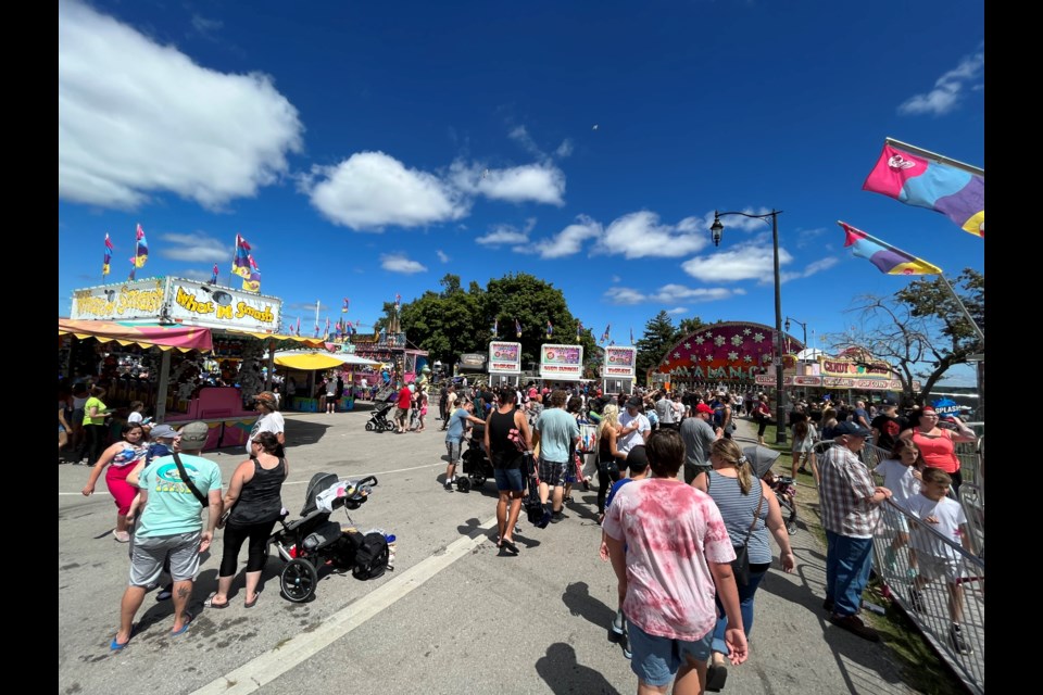 Crowds check out the midway at Centennial Beach during Kempenfest on Saturday, July 30, 2022. 