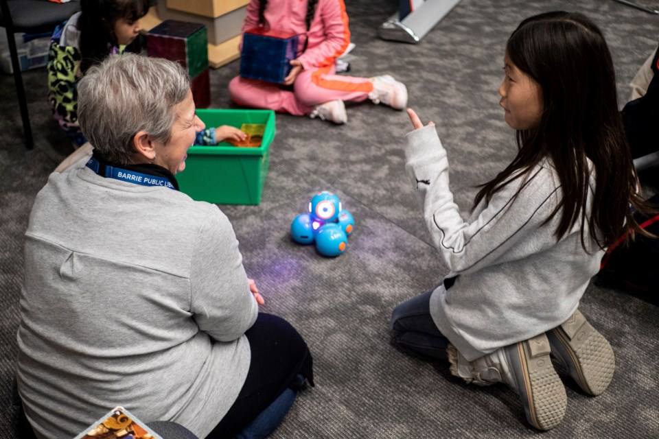 Children participate in story time and games at the Barrie Public Library.