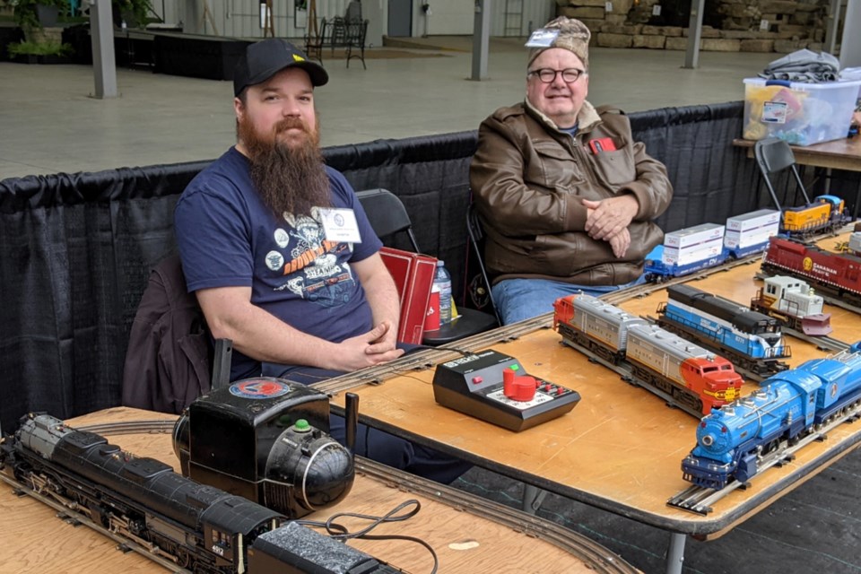 Benjamin Moore, left, and his father Kevin, at the Model Train Show.