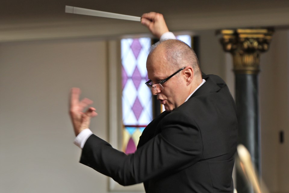 Oliver Balaburski, artistic director and conductor of the Huronia Symphony Orchestra, in action, as they perform at the Collier Street United Church on Sunday, March 24.