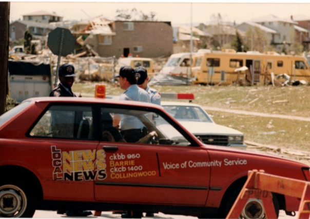 Martin Vanderwoude reported on the Barrie Tornado in 1985 for local radio station CKBB. His colleague at the time, Bob Young, photographed the reporter at the scene.