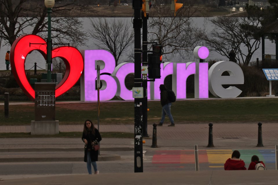 Semi-darkness brought the lights on in downtown Barrie during the peak moment of 97 percent sun coverage by the moon during the eclipse on Monday.