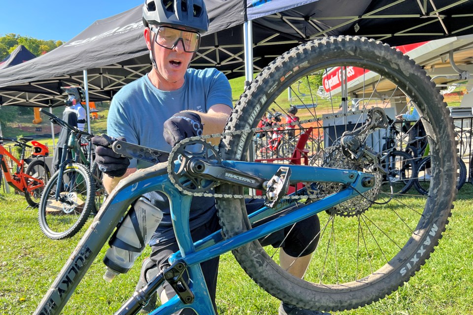 A rider troubleshoots an issue with his bike at the Horseshoe Valley Bike Fest, hosted by Horseshoe Resort in Oro-Medonte on Saturday.