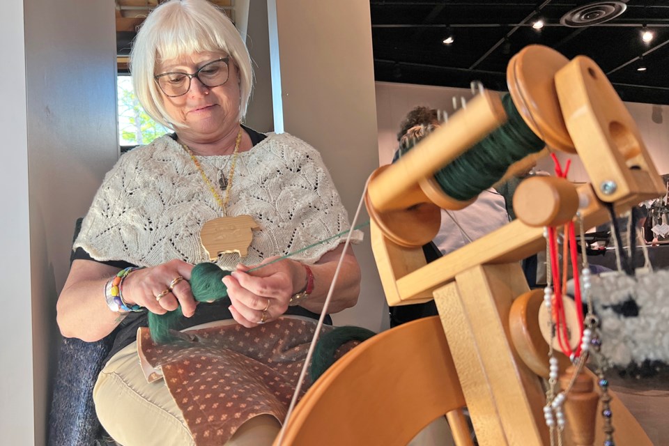Marg Salter of Barrie works at a spinning wheel at the Simcoe County Quilt, Rug and Artisan Fair at the Simcoe County Museum in Midhurst on Saturday.