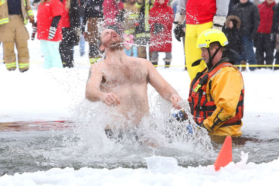 A flair for the dramatic also helped to get cheers from the crowd during the polar dip into Kempenfelt Bay on the final day of Winterfest in Barrie on Sunday, February 4, 2018. Kevin Lamb for BarrieToday.