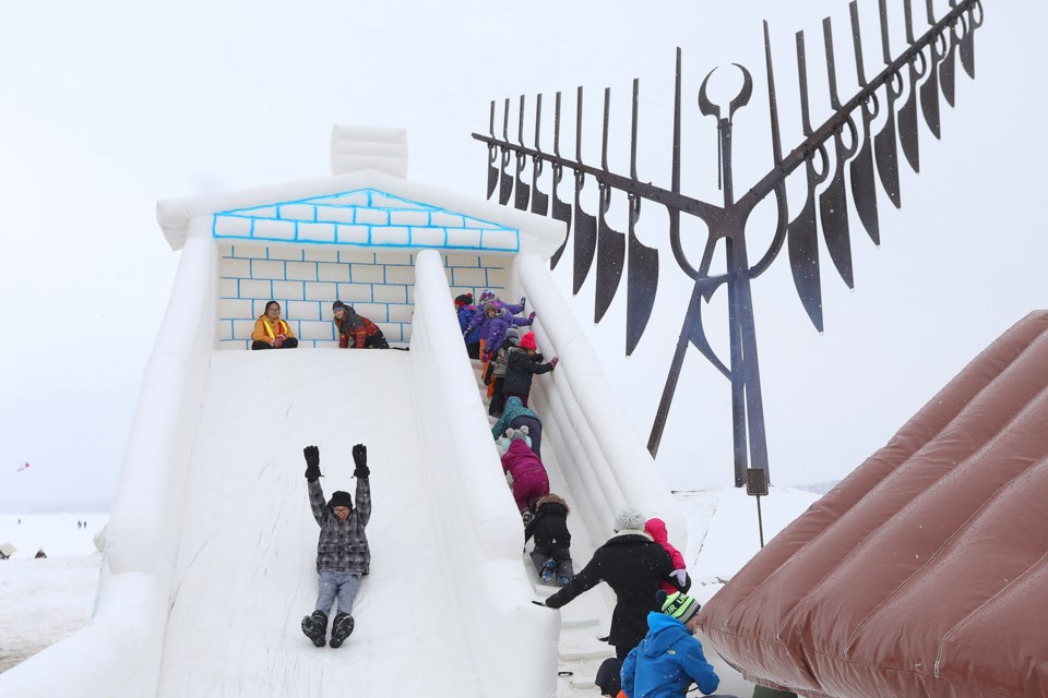 Demand was high for the slide at the foot of the Spirit Catcher during the final day of Winterfest at Heritage Park in Barrie on Sunday, Feb. 4, 2018. Kevin Lamb for BarrieToday.