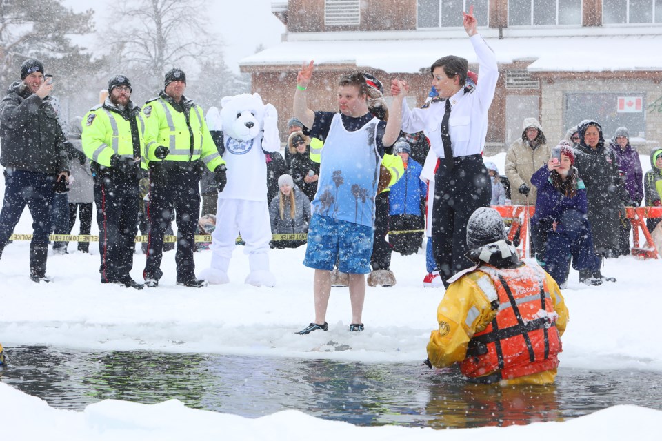 Special Olympics athlete Jason Helmond counts down with partner Barrie Police Chief Kimberley Greenwood while taking part in the Polar Plunge for Special Olympics Ontario at Centennial Beach in Barrie on Saturday, Feb. 10, 2018. Kevin Lamb for BarrieToday.