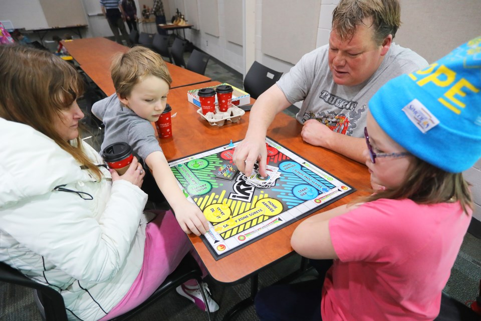 Ronda Hill along with Chase, Sophie and Chris Maynard, enjoy a game of Sorry! during Family Day activities at the Simcoe County Museum on Monday, Feb. 19, 2018. Kevin Lamb for BarrieToday