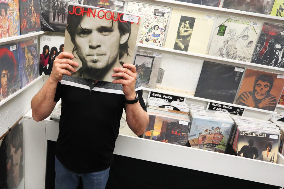 Store owner Bill Loiselle does his best John Mellencamp impersonation as Record Store Day was celebrated at BJ Records and Nostalgia on Clapperton Street in Barrie on Saturday, April 21, 2018. Kevin Lamb for BarrieToday.