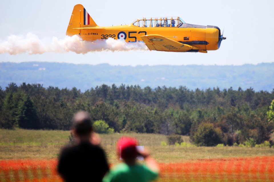A World War Two era airplane comes in low to wow the fans at the Canadian Armed Forces Day & Air Show held at CFB Borden on Saturday, June 2, 2018. Kevin Lamb for BarrieToday.
