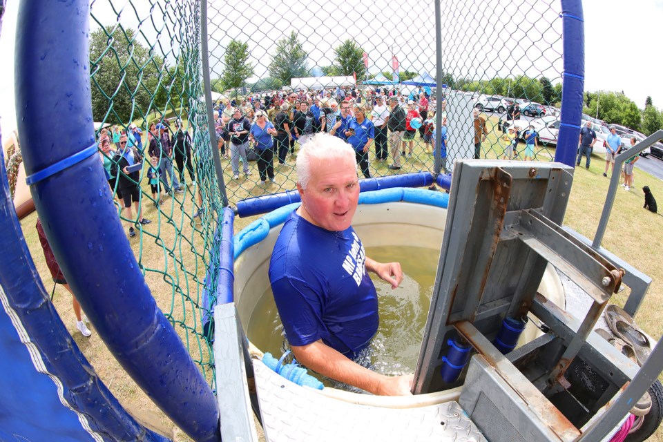Barrie-Innisfil MP John Brassard is the victim of the dunk tank during his 3rd Annual Community BBQ at the Stroud Arena on Saturday. Kevin Lamb for BarrieToday.