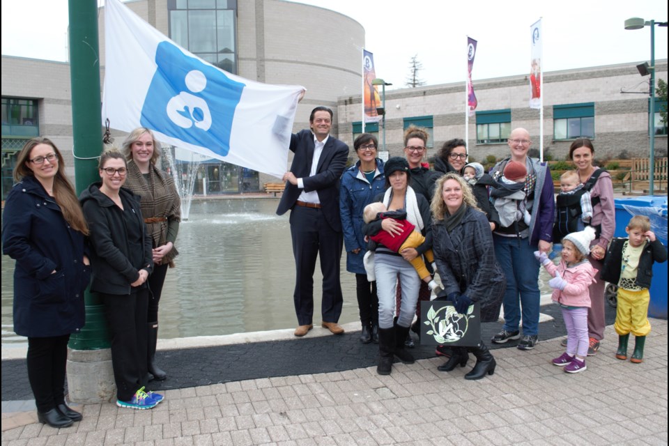Local dignitaries, the mayor, the health unit and local moms  came together Monday afternoon to raise a flag to celebrate the kick off of National Breastfeeding Week from Oct. 1 to 7. Jessica Owen/BarrieToday