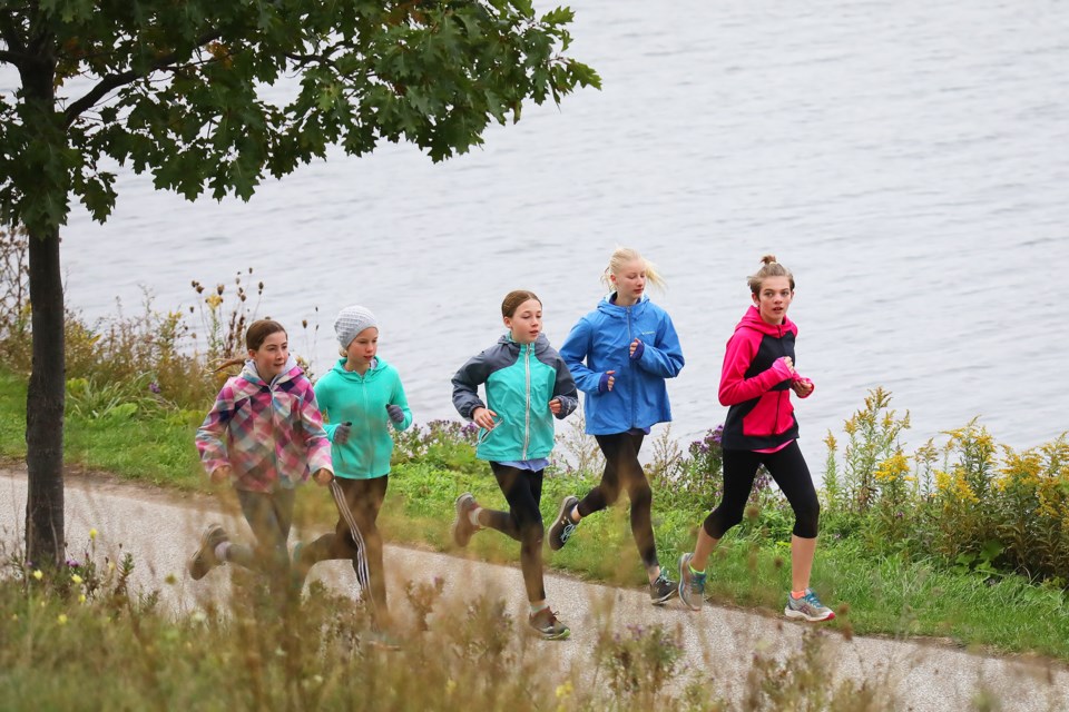 The South Simcoe Dufferin Track and Field Club makes its way along the lakeshore during their annual Fall Fund Run at the Southshore Community Centre in Barrie on Saturday, Oct. 6, 2018. Kevin Lamb for BarrieToday