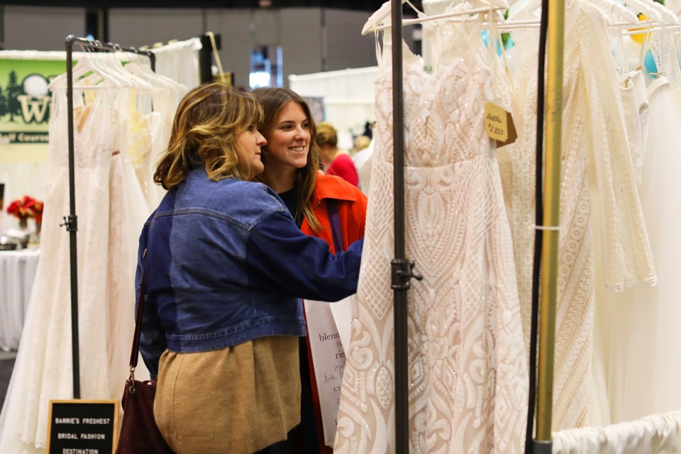 Samantha and Barbara White look over dresses at the Simcoe County Bridal Show held at the Molson Centre in Barrie on Saturday, October 20, 2018. Kevin Lamb for BarrieToday.