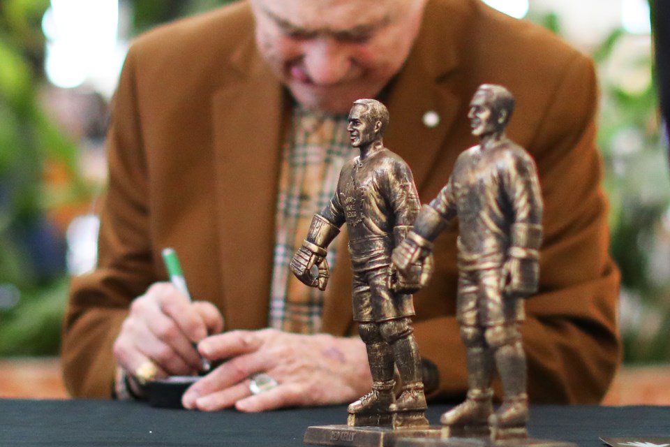 Toronto Maple Leaf legend Red Kelly signs autograph on pucks, photos, and statues at the Kozlov Centre on Saturday, October 20, 2018. Kevin Lamb for BarrieToday.