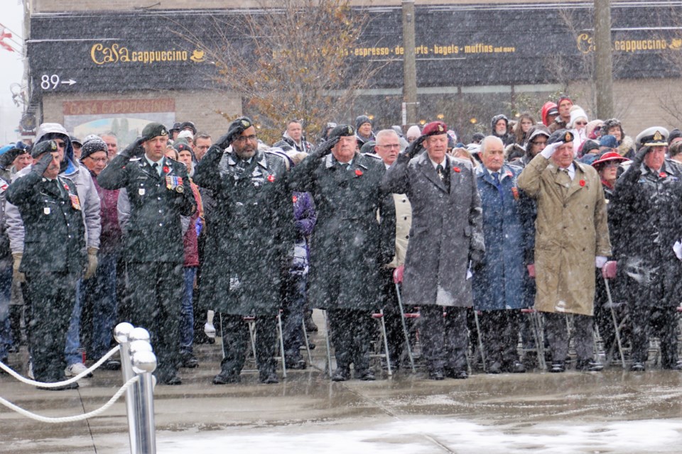 Local veterans salute the wreaths that were laid at the Cenotaph on Monday during Remembrance Day festivities. Jessica Owen/BarrieToday  