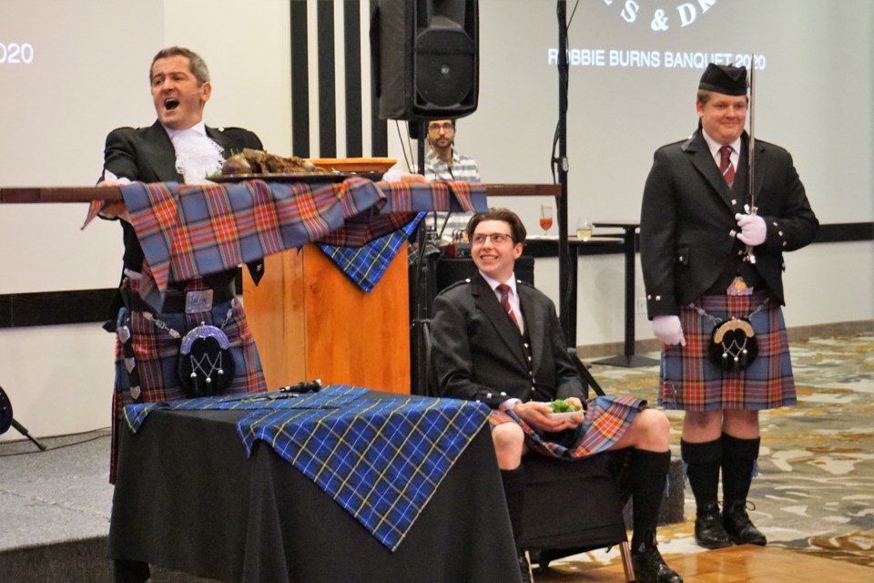 Barrie Pipes and Drums members perform in a reading of Robbie Burns' Address to a Haggis. Jessica Owen/BarrieToday           