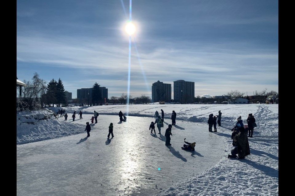 Revellers hit the ice at Heritage Park in downtown Barrie during the Hello Winter celebration on Saturday, Feb. 5, 2022. 