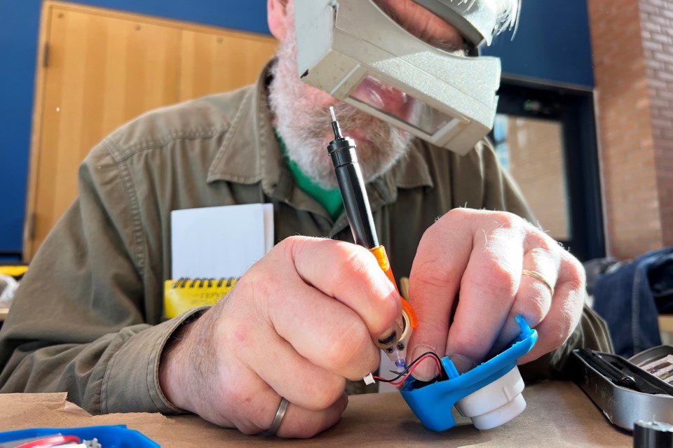 Bill Scott has been fixing broken items for most of his life, and one of the items he fixed Saturday was a digital camera while at the Repair Café event at the downtown branch of the Barrie Public Library.