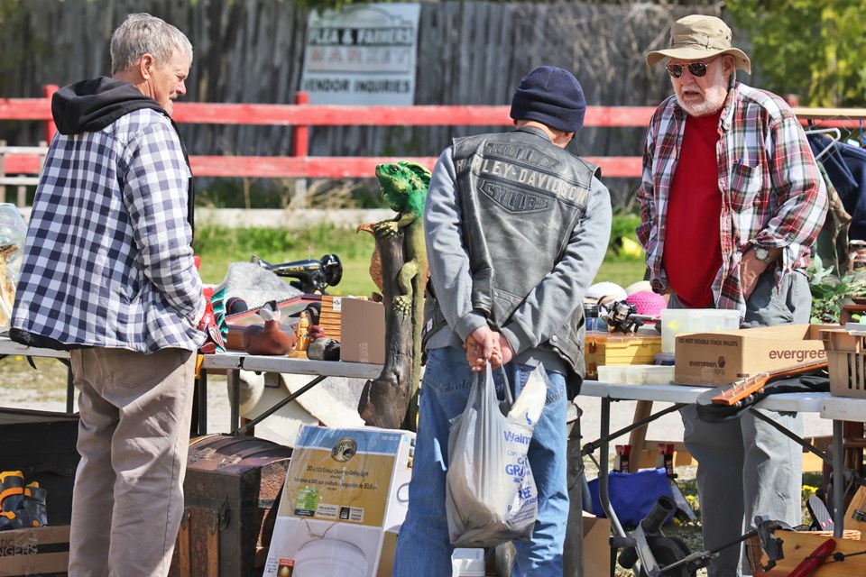 Brian Hymander, far right, a vendor at the Elmvale Flea Market. 