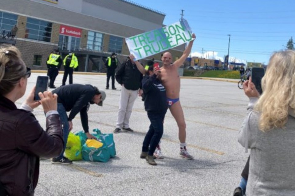 A thong-wearing Weldon Hachey is pictured at demonstration outside Barrie's Sadlon Arena in this May 8, 2021 file photo