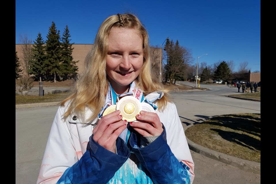 Kristy Alford shows off her two gold medals and one silver from the recent Summer Games in Abu Dhabi. Shawn Gibson/BarrieToday