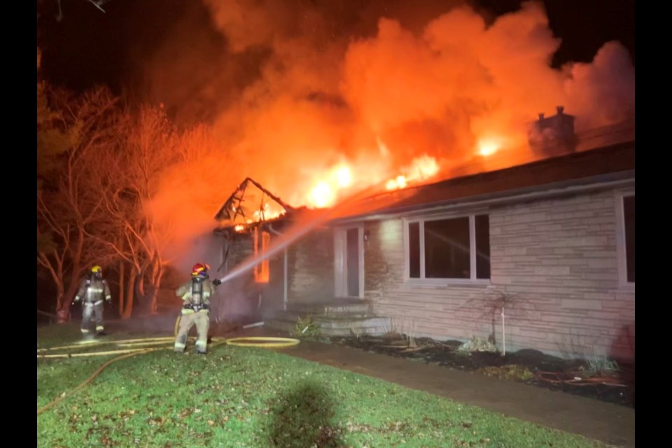 Springwater Township fire crews battle an early morning blaze on Old Second South on Dec. 7, 2022.