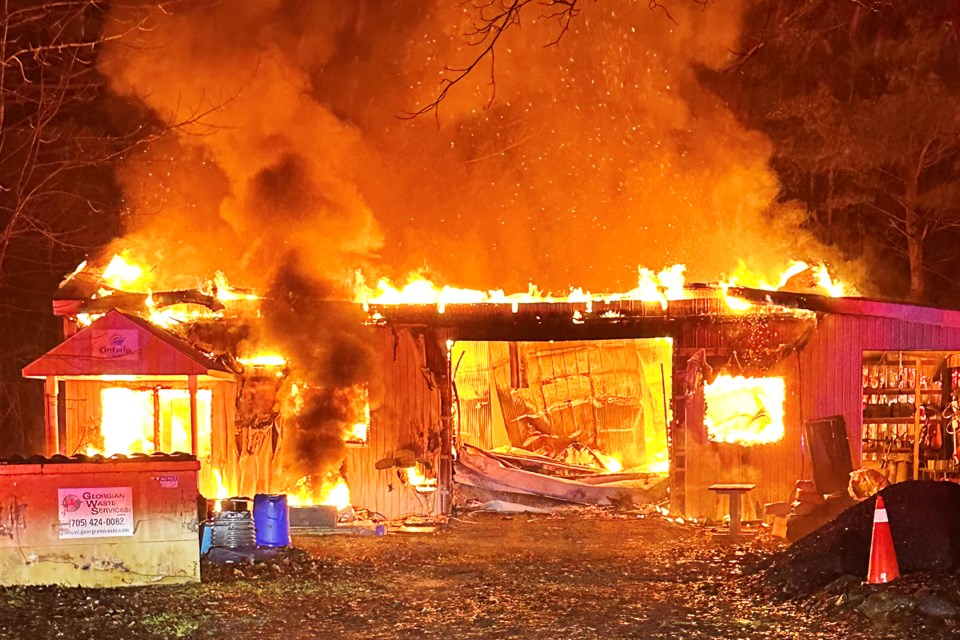 A shop on Dwyer Road in Midhurst is fully engulfed as Springwater fire crews battled the blaze on Thursday night. There were no injuries, and the fire was not deemed suspicious.