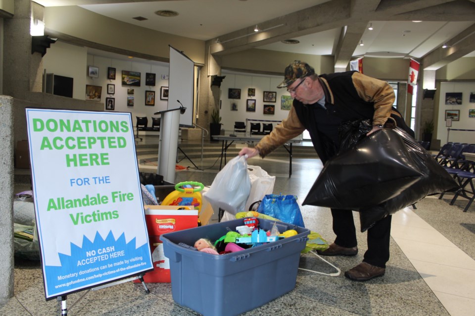Peter Gorbell drops off donations at the Barrie City Hall Rotunda on Wednesday following Monday night's fire on Little Avenue. Items are being accepted until Friday at 4:30 p.m. Raymond Bowe/BarrieToday