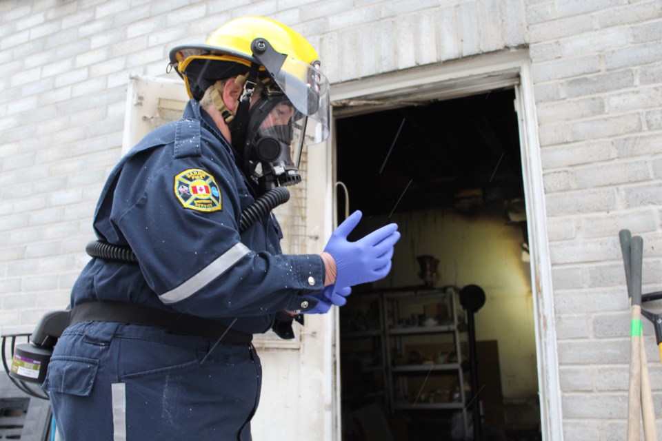 Barrie fire prevention officer Carrie Clark prepares to enter a garage where a residential blaze happened the morning of Dec. 30, 2018, on Patterson Road. Raymond Bowe/BarrieToday