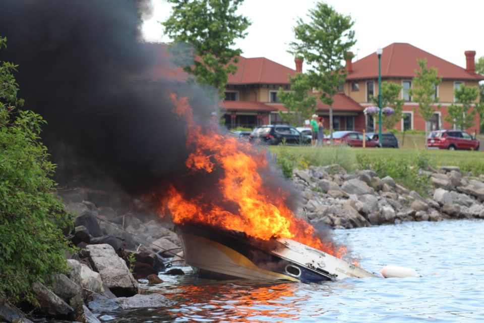 Barrie firefighters battle a boat fire after it re-ignited along the shore of Kempenfelt Bay on Canada Day. Raymond Bowe/BarrieToday