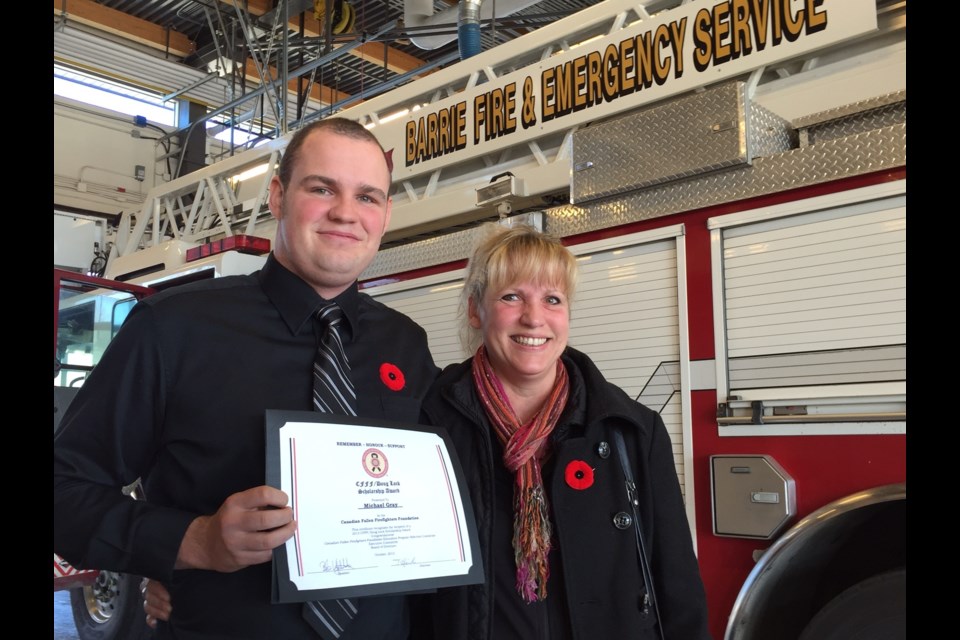 Michael Gray poses with his mom Carolyn after he was awarded a scholarship from the Canadian Fallen Firefighters Foundation.  Sue Sgambati/BarrieToday