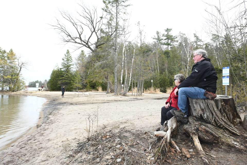 Arthur Staines, along with his wife Alicia, enjoy the view from what was formerly known as Wilkins Beach, located on the south side of Kempenfelt Bay near Golden Meadow Road. The beach area will be closed this summer, but access to nearby trails will remain, if a staff report is accepted by city councillors. 