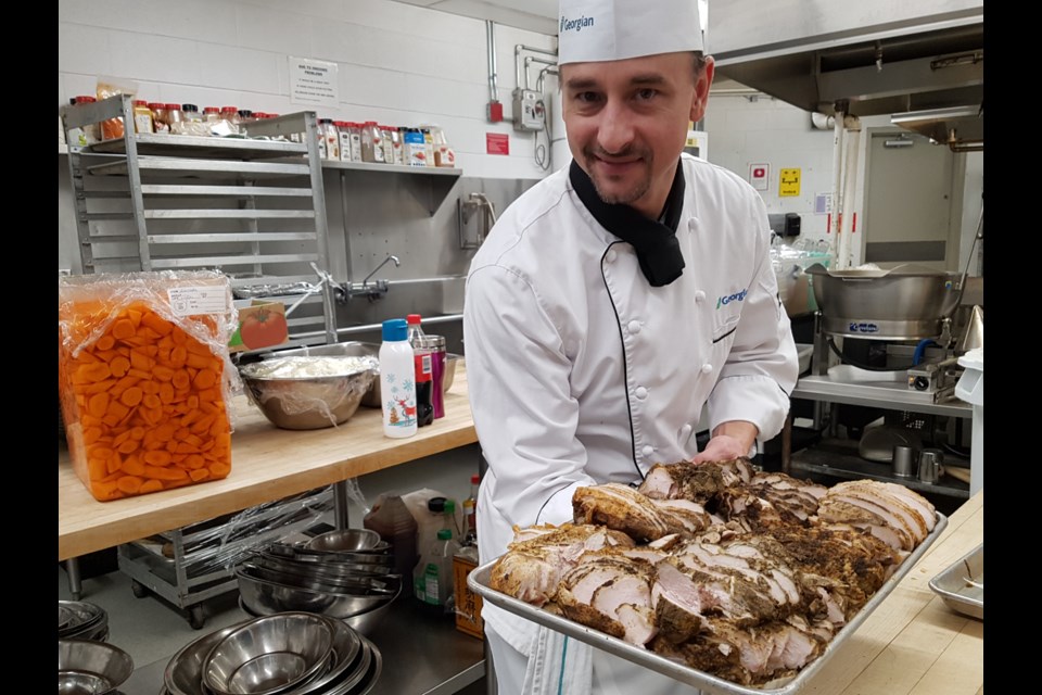 Chef Philip Leach shows off some of the mouth-watering food that will be served up Tuesday to the David Busby folks. Shawn Gibson/BarrieToday