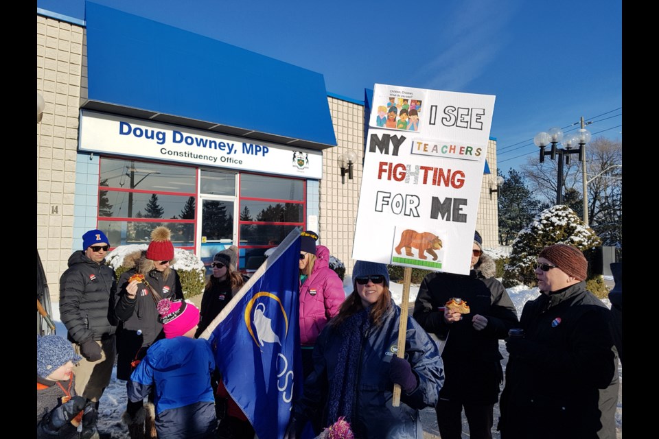 Protesters rallied outside local MPP Doug Downey's Bell Farm Road office Thursday to voice their disdain for potential cuts to education. Shawn Gibson/BarrieToday