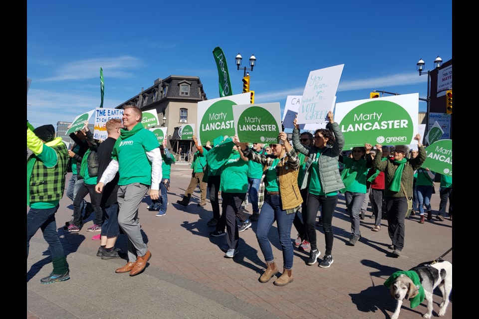 The Five Points went green whenever the crossing light gave Marty Lancaster supporters a green light, Saturday in downtown Barrie. Shawn Gibson/BarrieToday