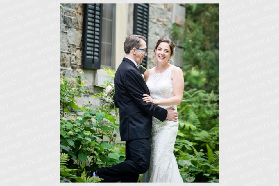 Dr. Coryn Hayman is shown in an undated photo with his wife Charlotte Coughler. 