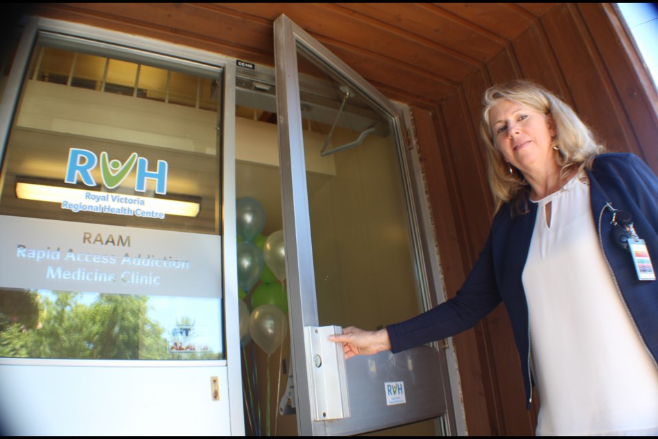 Angela McCuaig, Royal Victoria Regional Health Centre's manager of addiction services, opens the door to the new North Simcoe Muskoka Regional Rapid Access Addiction Medicine (RAAM) clinic, which opened in Barrie on Tuesday. An open house was held Monday at the Barrie facility, located at 70 Wellington St. W. Raymond Bowe/BarrieToday