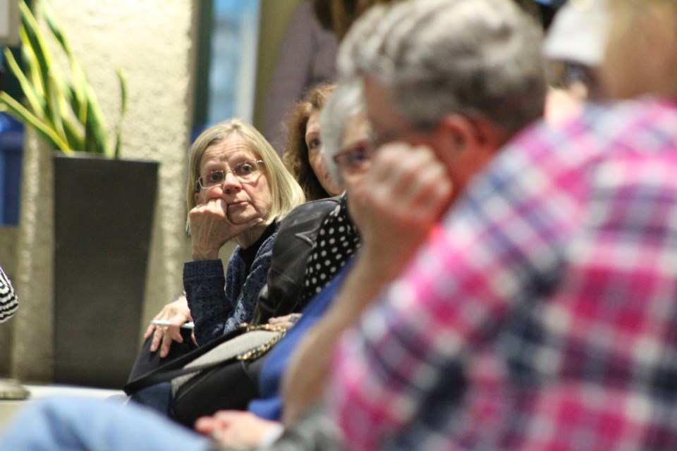 A woman listens during a town hall meeting on the opioid crisis, April 24, 2019 at Barrie City Hall. Raymond Bowe/BarrieToday