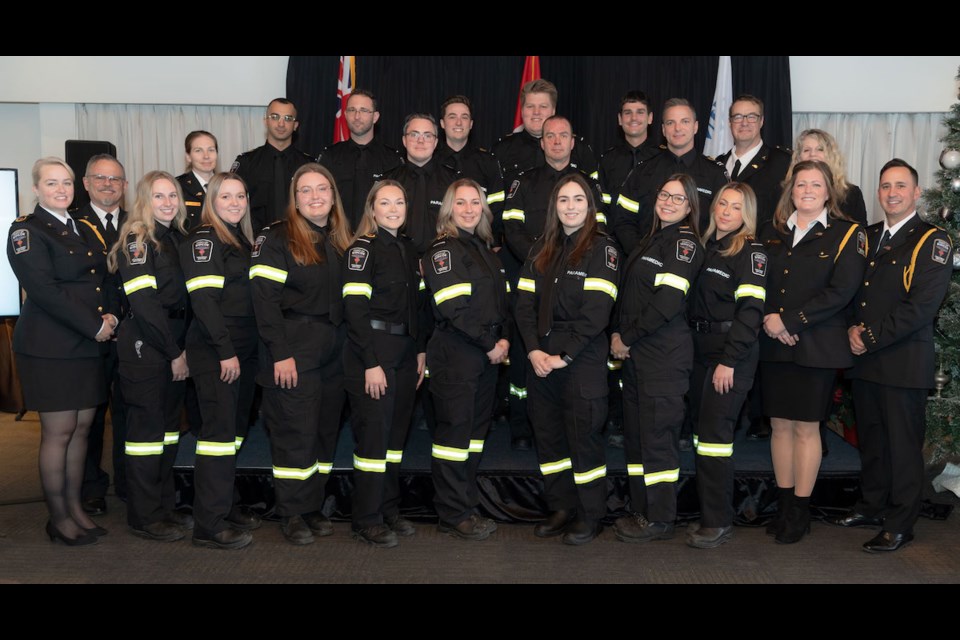 Members of the County of Simcoe Paramedic Services leadership team are joined by fall 2022 new recruit classes at the commencement and honours ceremony held on Nov. 30, 2023.