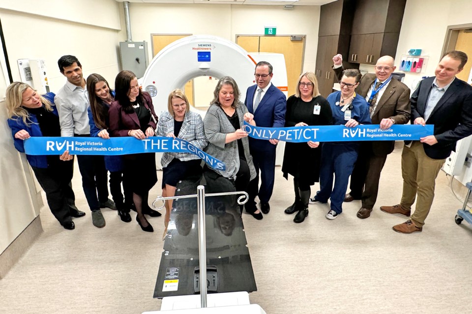 Dignitaries celebrate a ribbon cutting for the new PET/CT medical scanner's arrival at the hospital, on Feb 16. It is the first of its kind in the region.