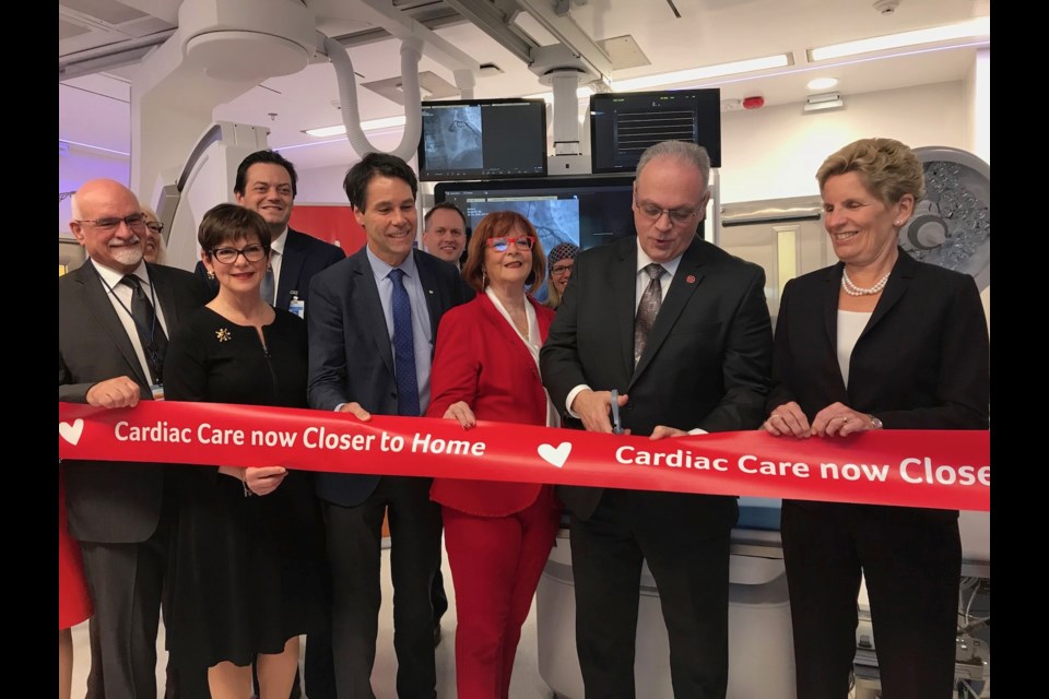 Rolland Desjardins, the first patient to be treated at the Simcoe Muskoka Regional Heart Program, cuts the ribbon with Premier Wynne, Health Minister Dr. Eric Hoskins, Barrie MPP Ann Hoggarth, Mayor Lehman, RVH President and CEO Janice Skot. Sue Sgambati/BarrieToday